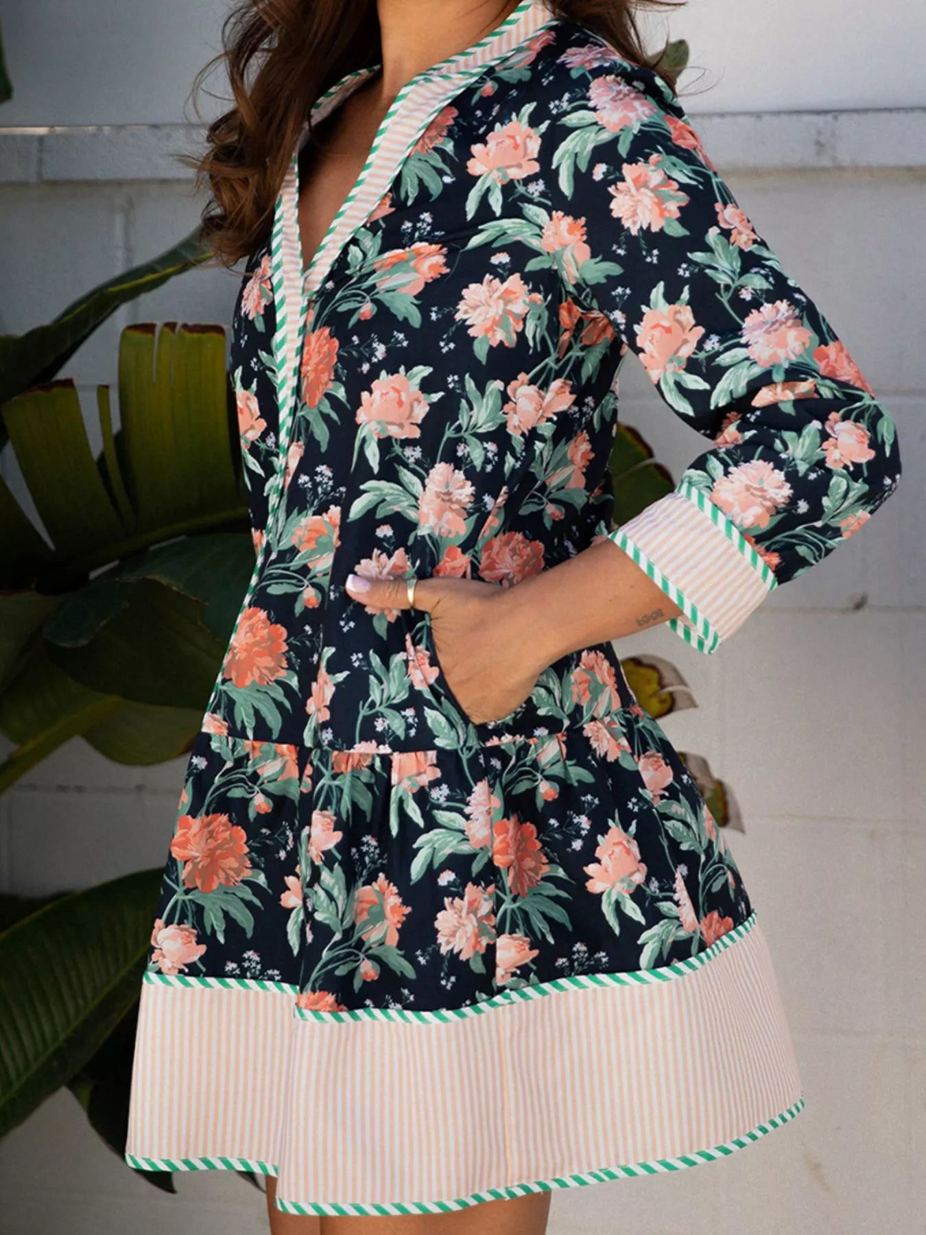 Floral print striped trim V-neck long sleeve shift mini dress with ruffle hem by Trendsi, featuring a stylish and feminine design.