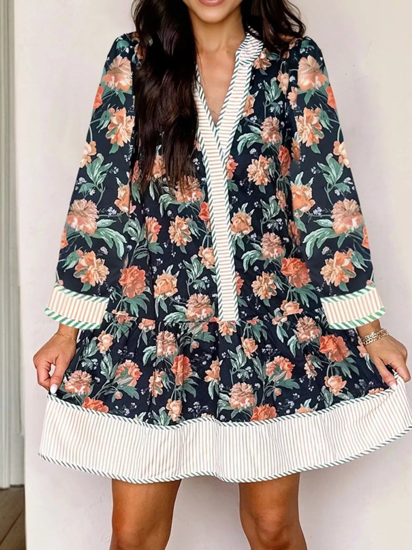 Floral print striped trim V-neck long sleeve shift mini dress with ruffle hem, by Trendsi.