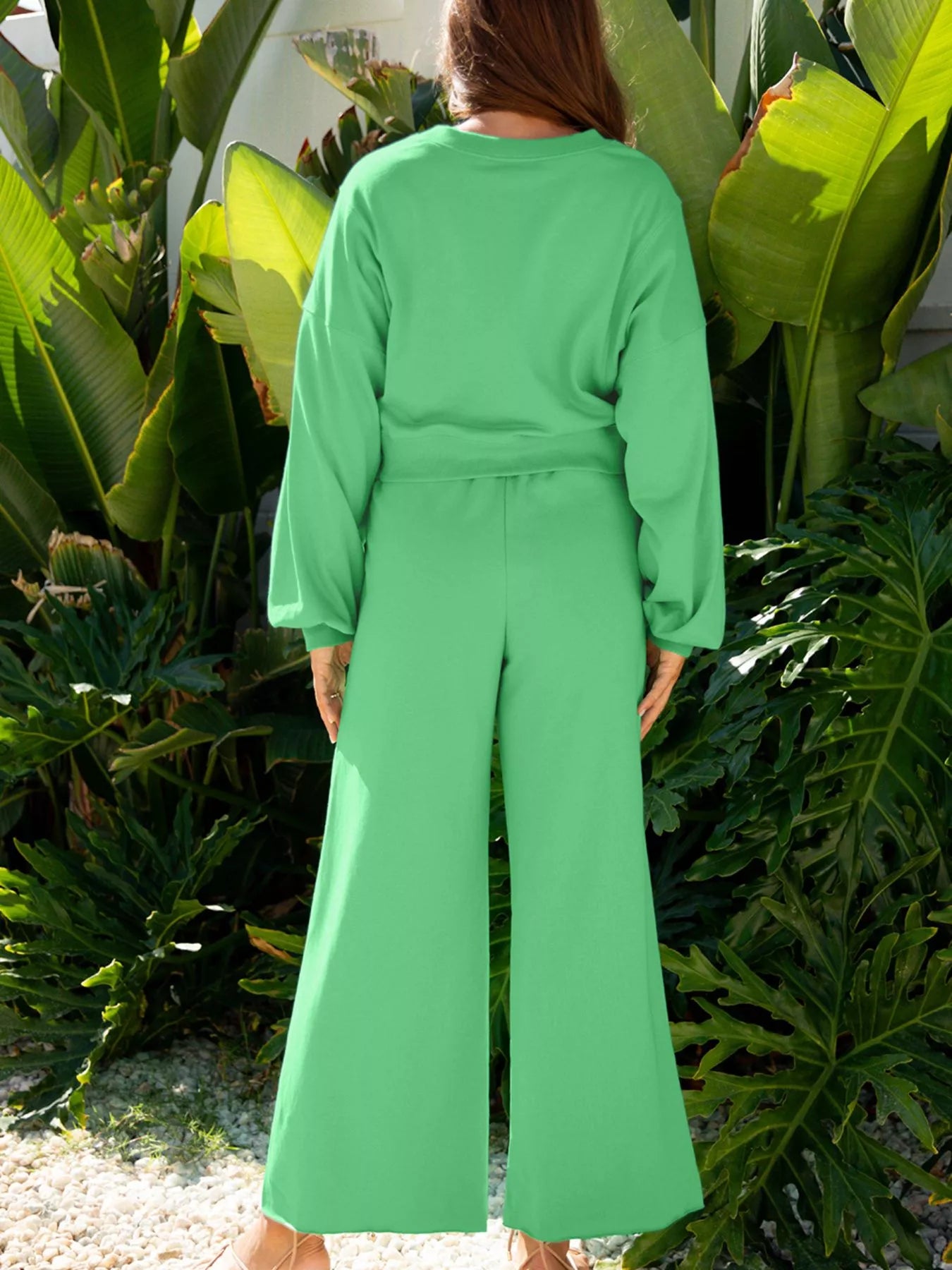 Green drop shoulder puff sleeve crop top with matching drawstring wide-leg pants set by Trendsi, stylish and comfortable ensemble.