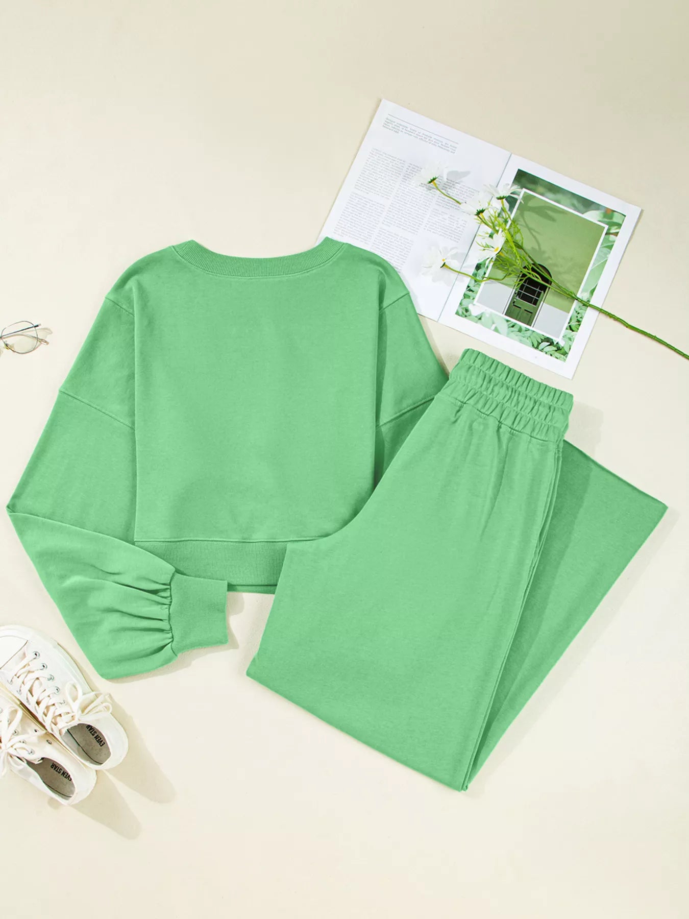 Green drop shoulder puff sleeve crop top with drawstring wide-leg pants set by Trendsi, styled together in a casual, trendy outfit.