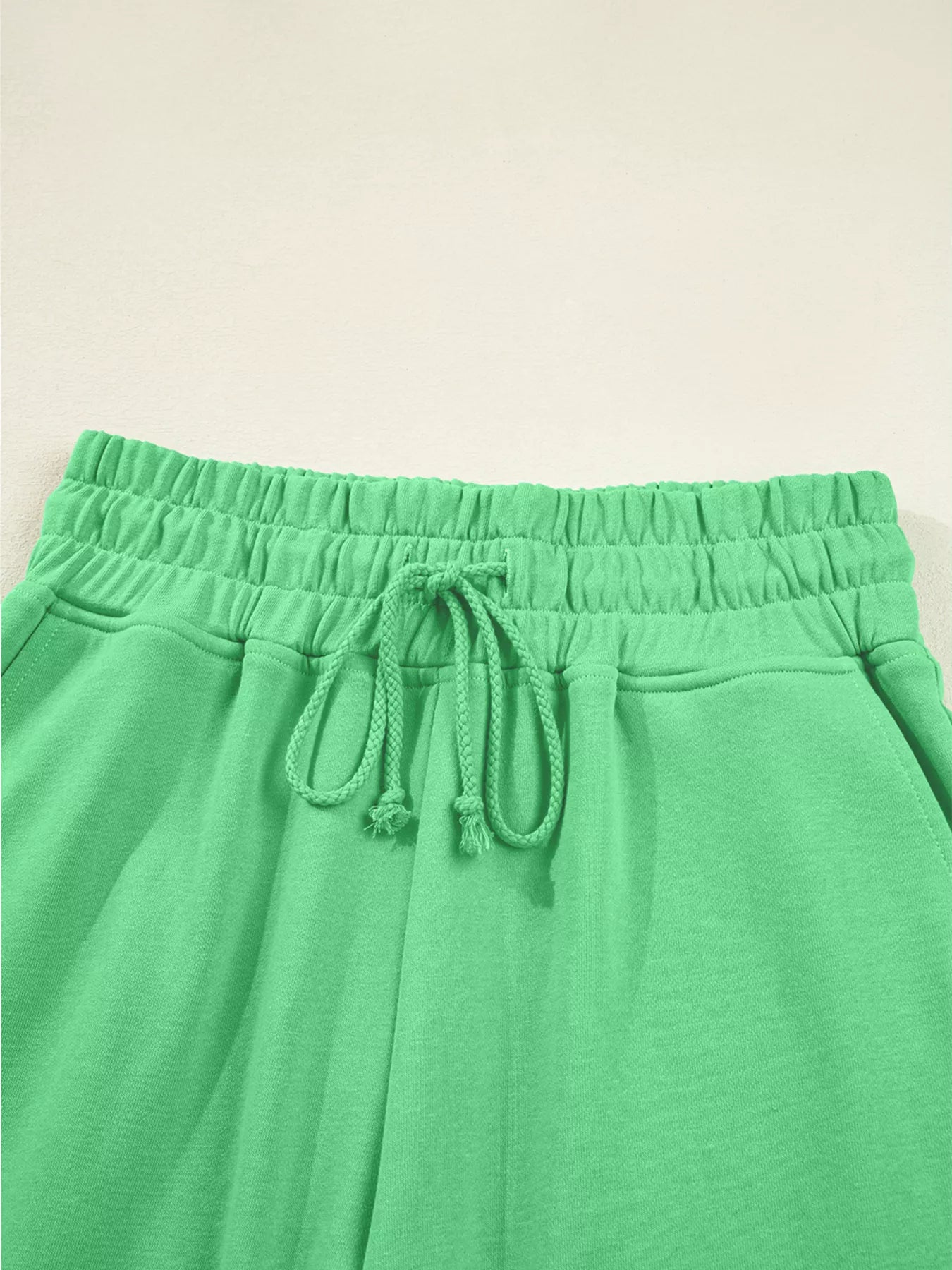 Green drop shoulder puff sleeve crop top and drawstring wide-leg pants set by Trendsi, stylish and comfortable for casual wear.