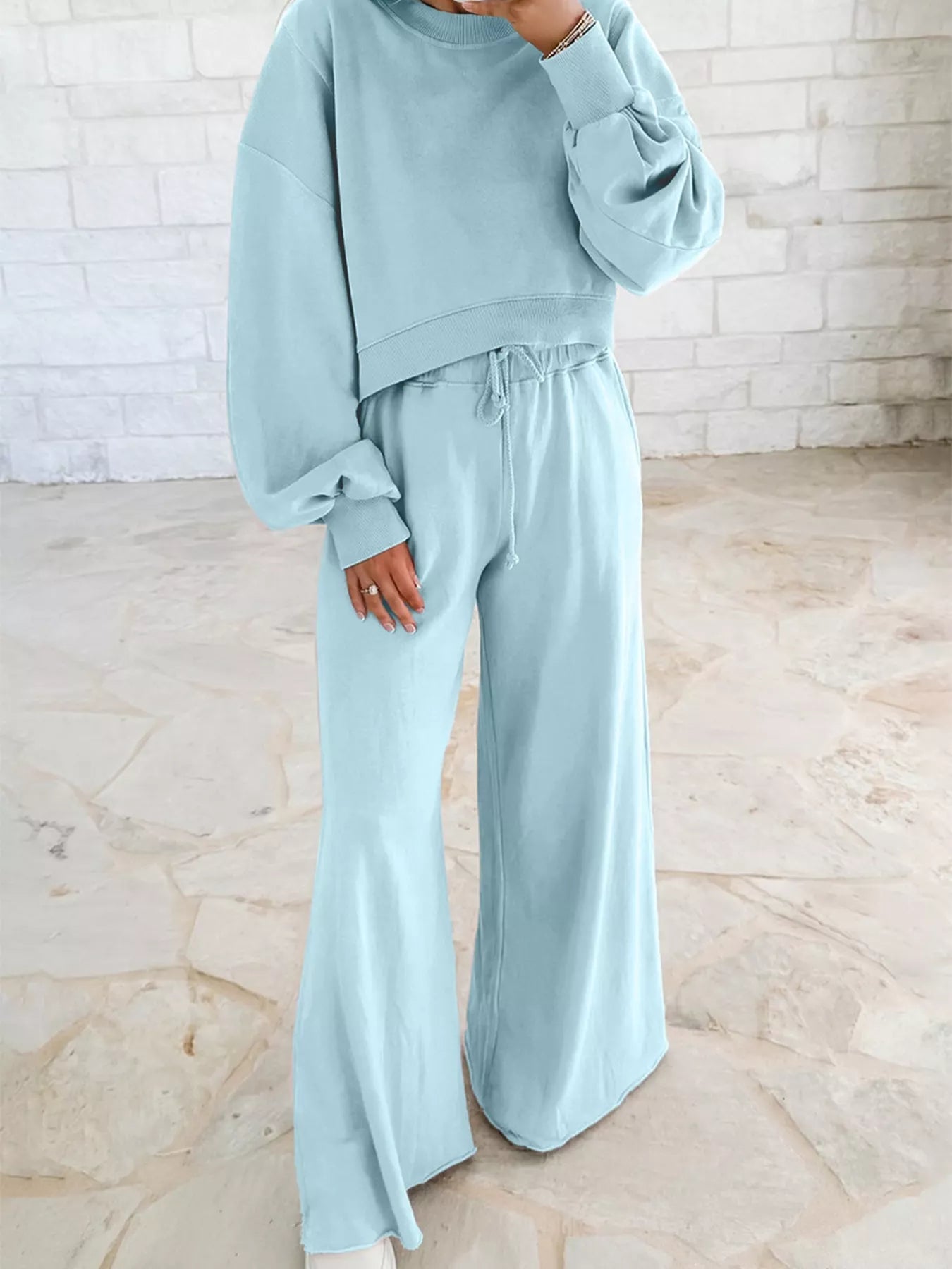 Green drop shoulder puff sleeve crop top with matching drawstring wide-leg pants set by Trendsi, stylish and comfortable for casual wear.