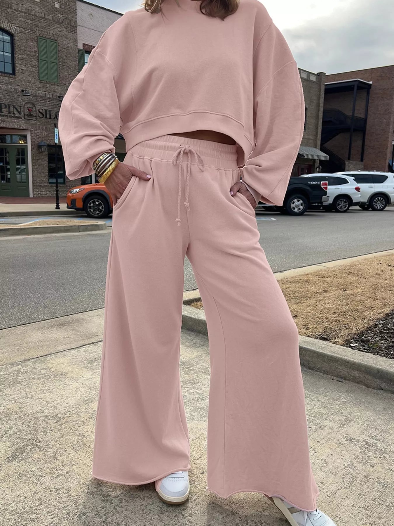 Green drop shoulder puff sleeve crop top and drawstring wide-leg pants set by Trendsi, stylish and comfortable ensemble for casual wear.