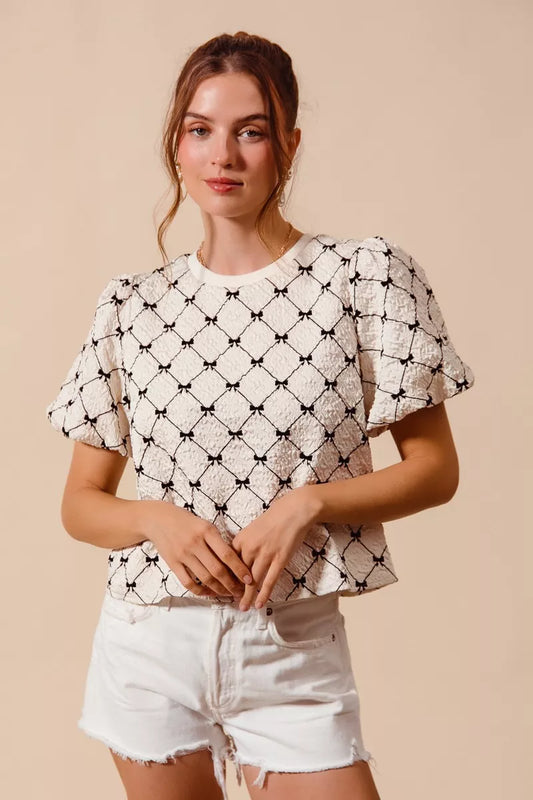 Ivory SO ME Bow Texture Woven Bubble Sleeve Top by Trendsi featuring a stylish bow detail and textured fabric.
