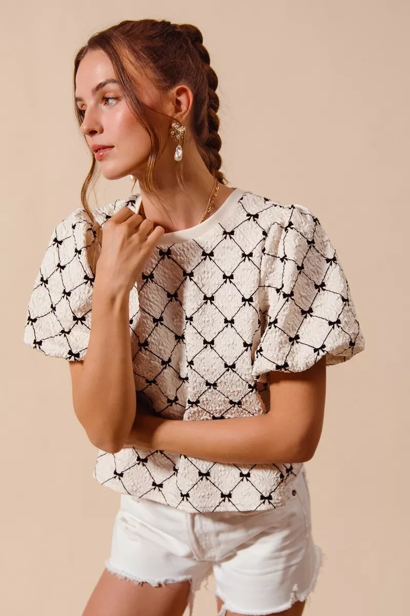 Ivory SO ME Bow Texture Woven Bubble Sleeve Top by Trendsi, showcasing a stylish woven fabric with puffed bubble sleeves.