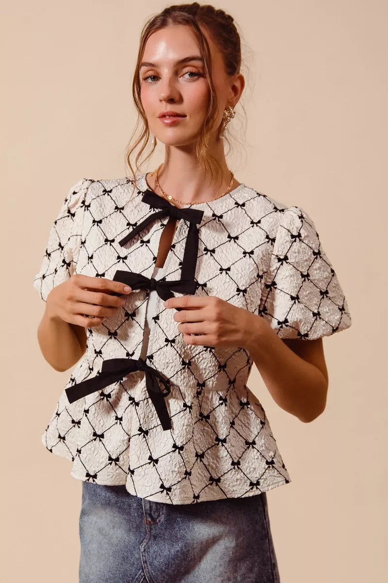 Ivory SO ME woven peplum top by Trendsi featuring bow texture, contrasting tie, and stylish design.