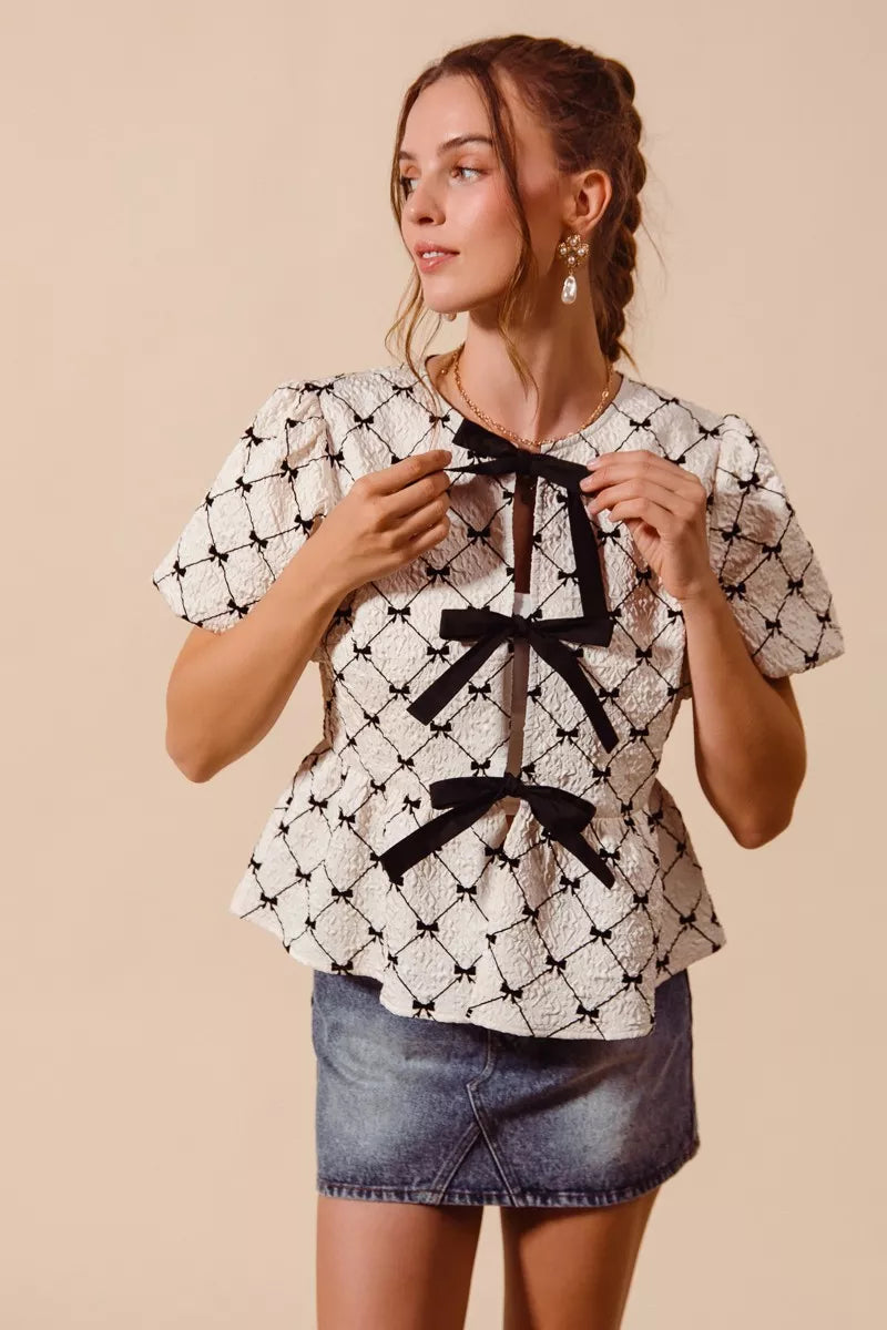 Ivory SO ME woven peplum top with bow texture and contrast tie, stylish women’s blouse from Trendsi.