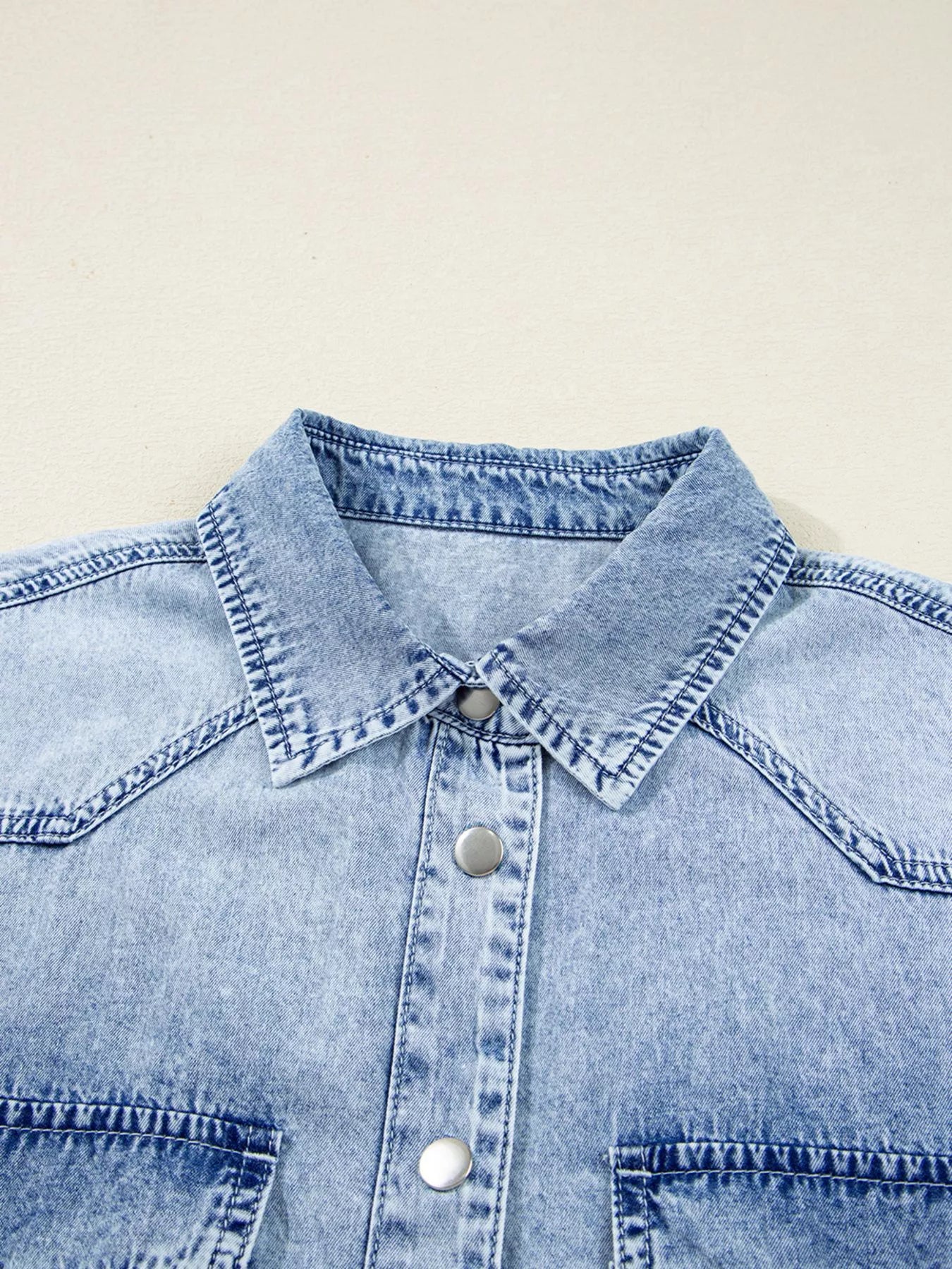 Light blue denim shirt dress with chest pocket and raw hem, loose fit by Trendsi.