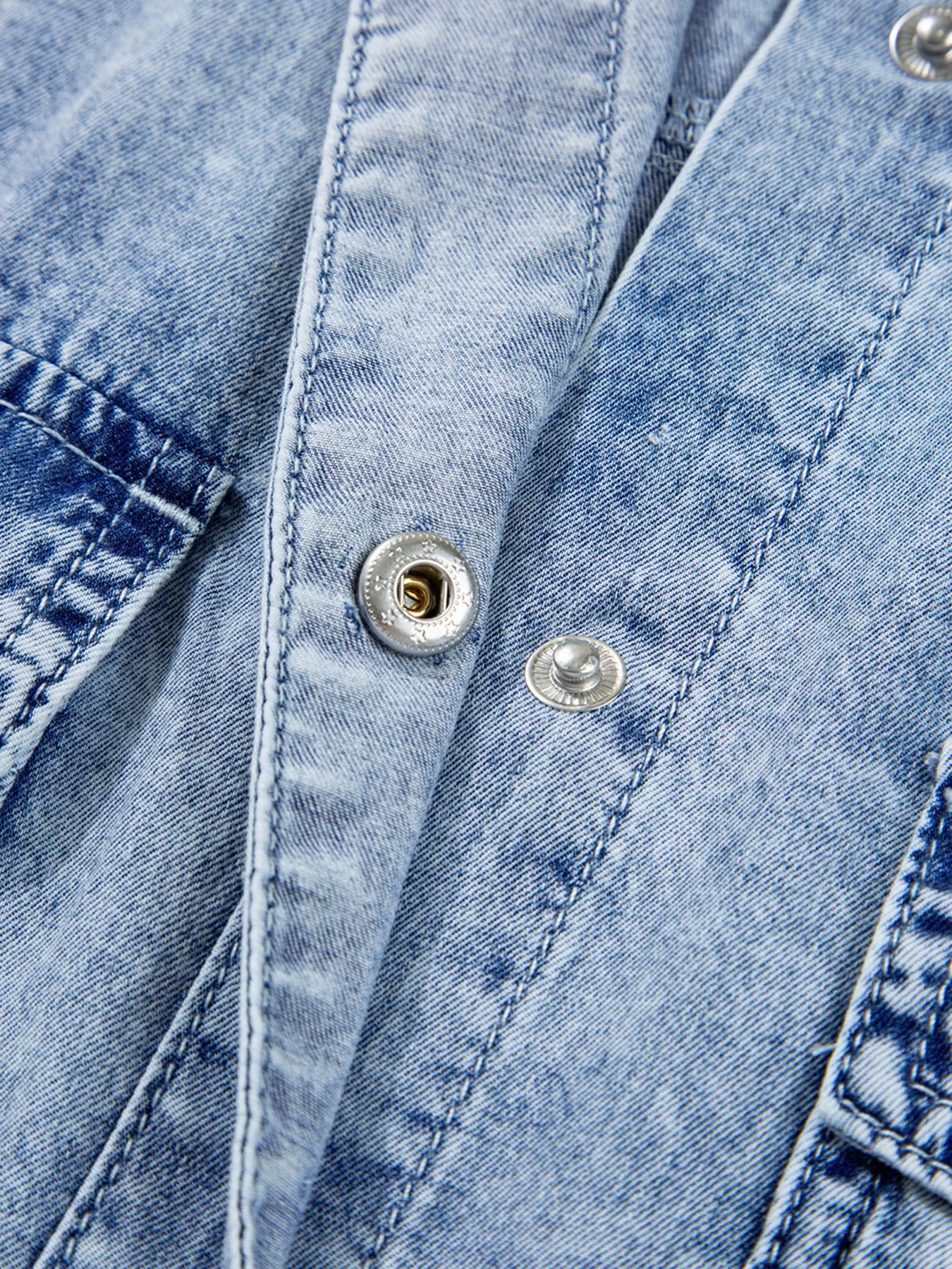 Light blue denim shirt dress with chest pocket and raw hem, loose fit, by Trendsi, displayed on a mannequin.