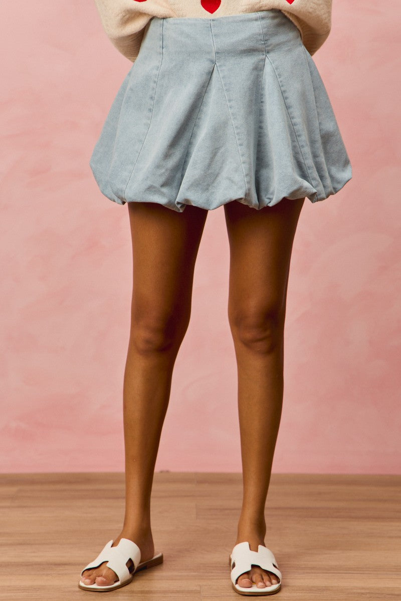 Light denim SO ME Bubble Mini Skirt by Trendsi, showing a fitted high-waist denim skirt with bubble hem detail.