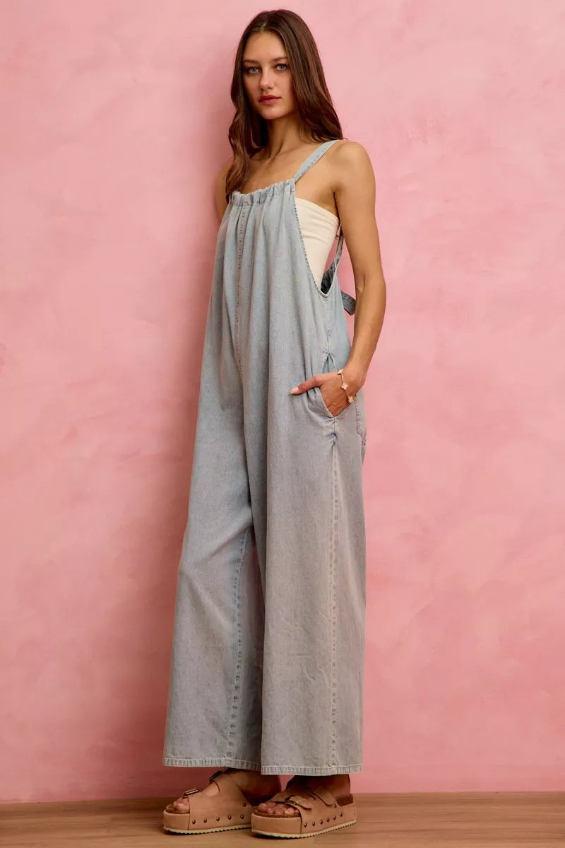 Light blue lightweight denim overalls with wide-leg design from SO ME by Trendsi, featuring adjustable straps and front pockets.