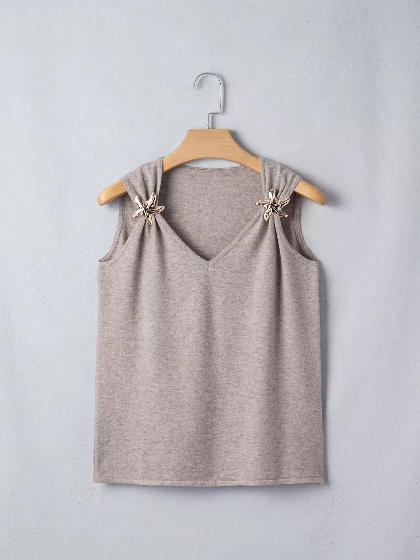 Mocha metal star detail V-neck sweater knit tank top by Trendsi, featuring a stylish V-neck and metallic star accents.