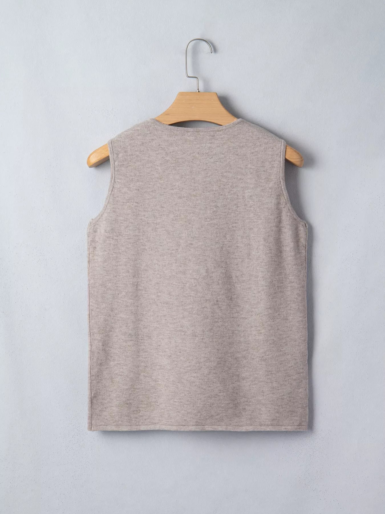 Mocha metal star detail V-neck sweater knit tank top by Trendsi, featuring a stylish V neckline and decorative star accents.