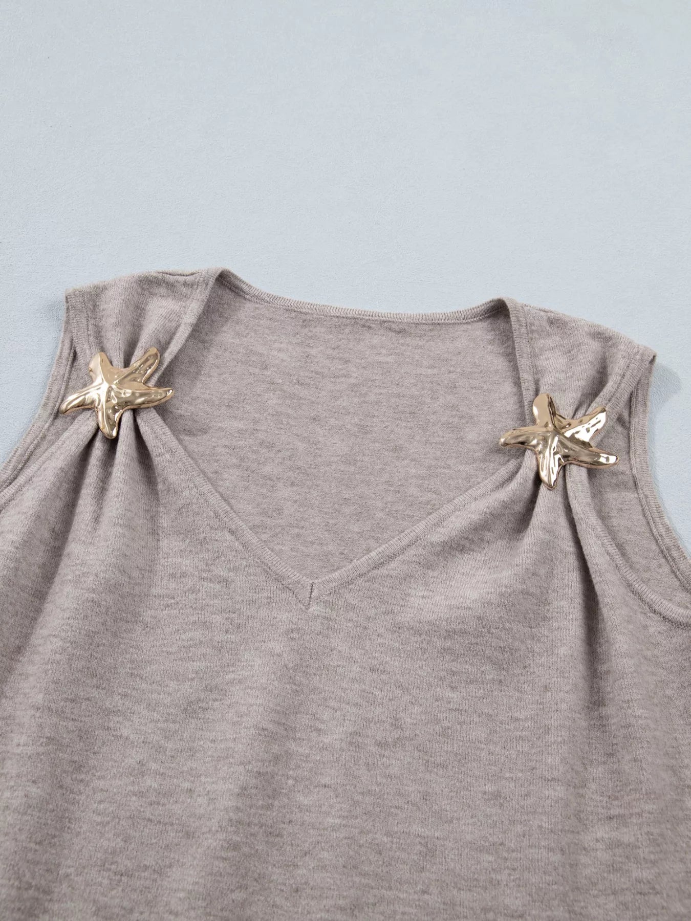 Mocha metal star detail V-neck sweater knit tank top by Trendsi, featuring a stylish V-neck and decorative star accents.