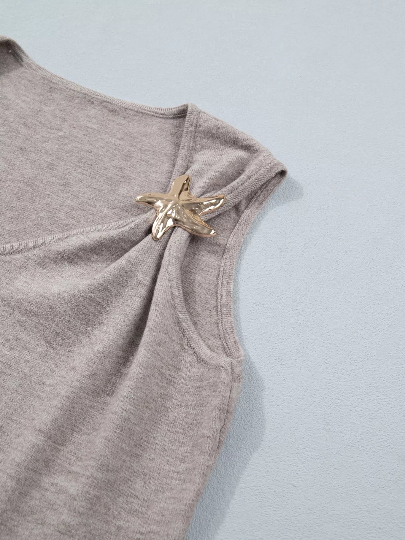 Mocha metal star detail V-neck sweater knit tank top by Trendsi, featuring a stylish V neckline and star embellishments.