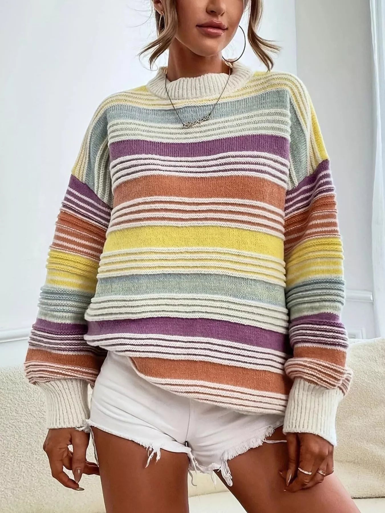 Yellow rainbow striped oversized sweater with drop shoulder design from Trendsi, featuring colorful horizontal stripes and a cozy fit.