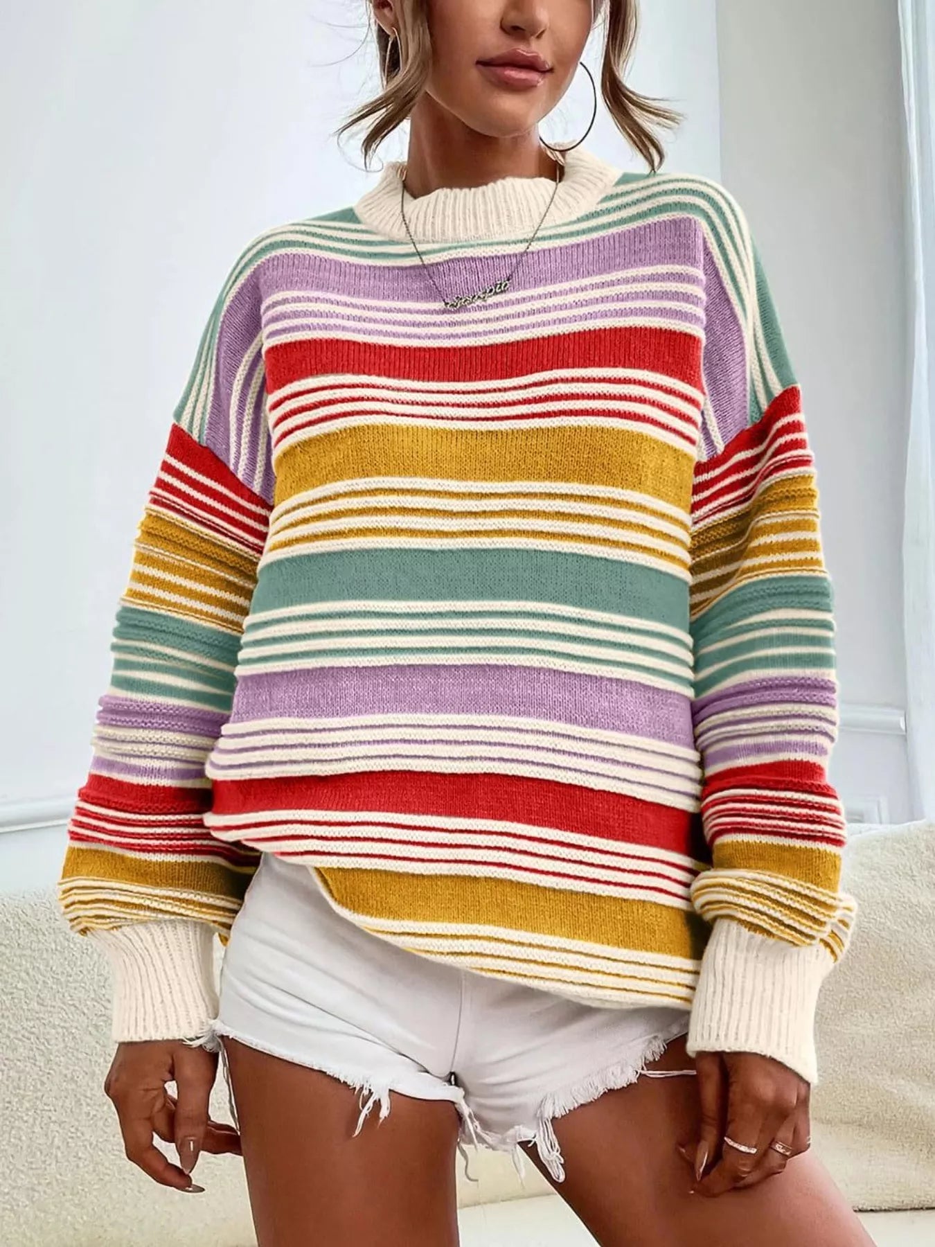 Yellow rainbow striped oversized sweater with drop shoulder design from Trendsi, featuring colorful horizontal stripes and cozy knit fabric.
