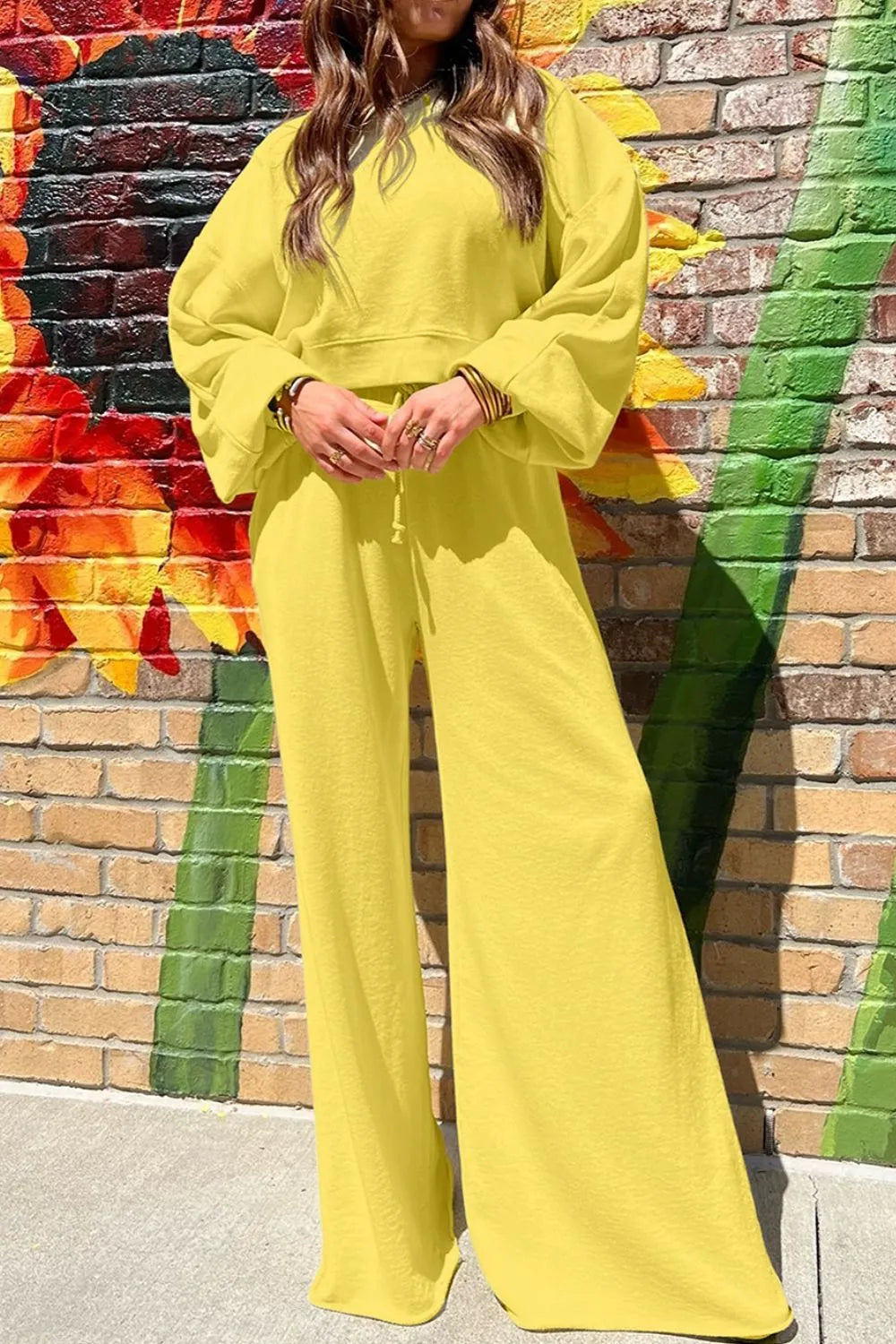Yellow Trendi round neck long sleeve sweatshirt and matching pants set, casual loungewear outfit for women.